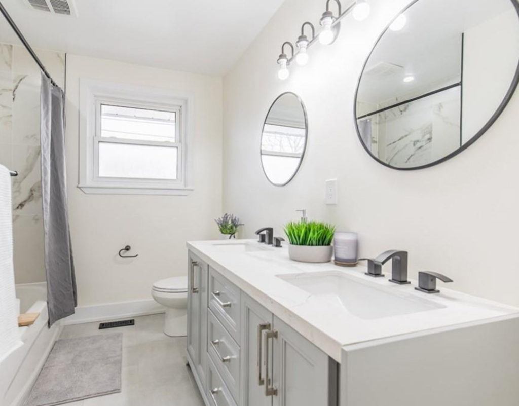 bathroom with double sinks in a white vanity