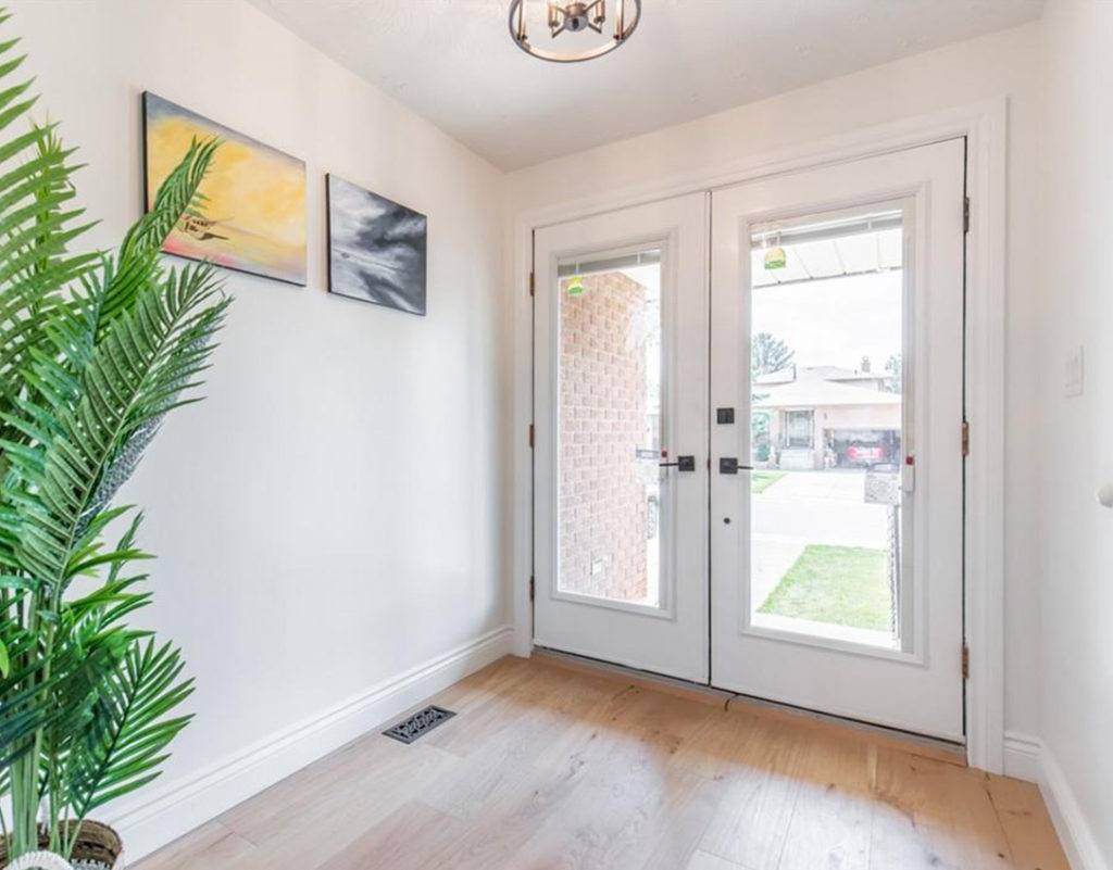 glass doors at the front entrance of a house