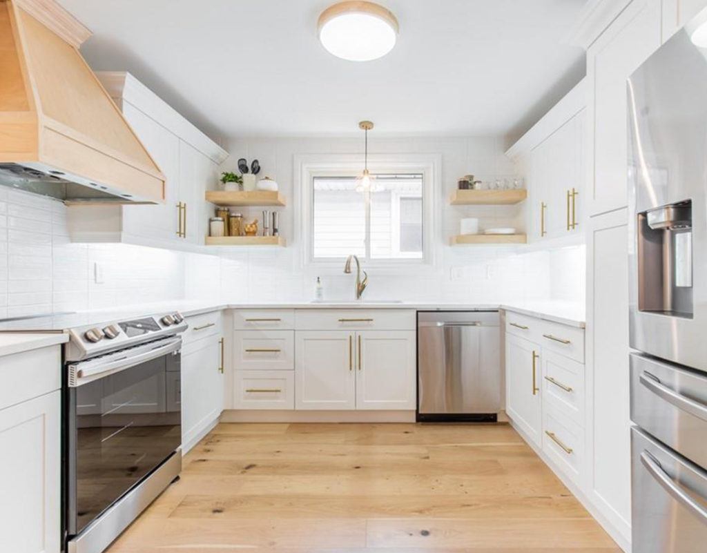 kitchen with hardwood floors white cabinets and countertops