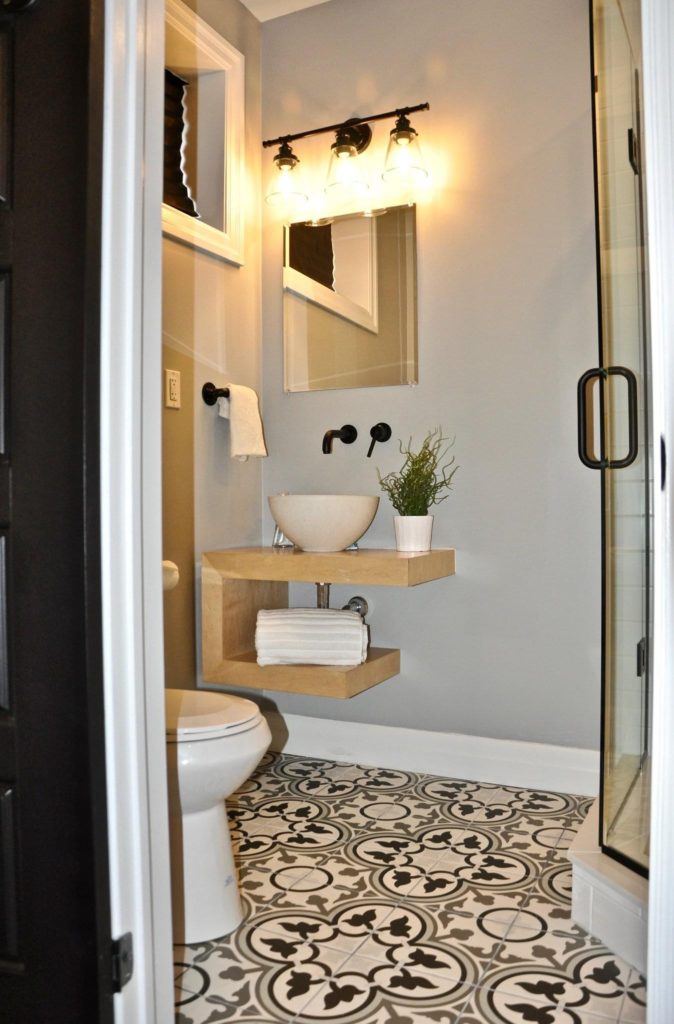 bathroom with black and white patterned floor