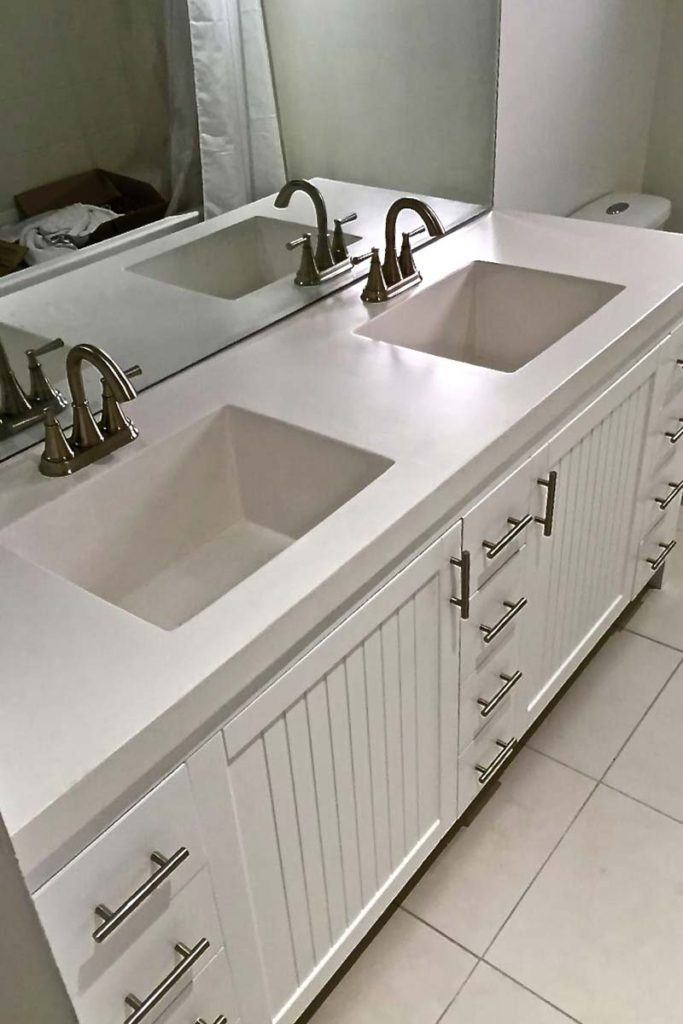 double bathroom sinks in a white vanity