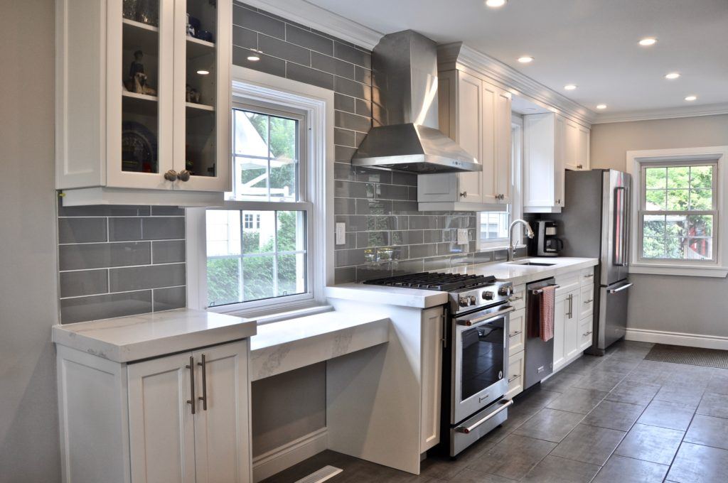 kitchen with white countertops and grey tiled floor