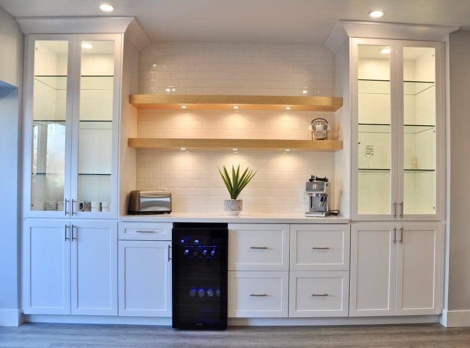 white shelving and cabinetry with white countertops