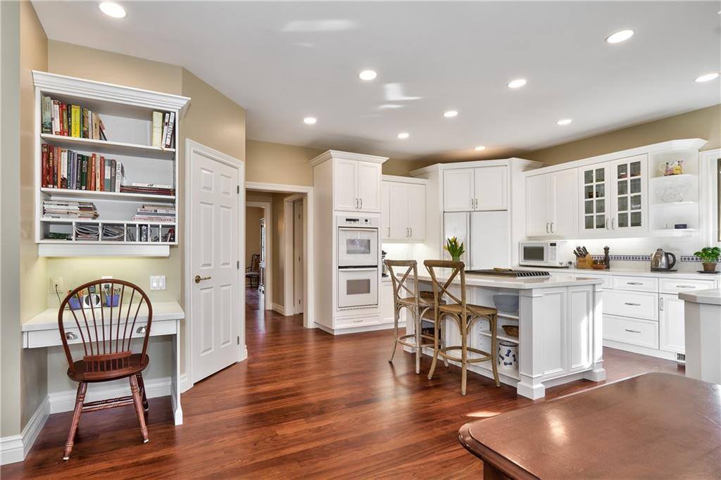 kitchen with white cabinets and countertops