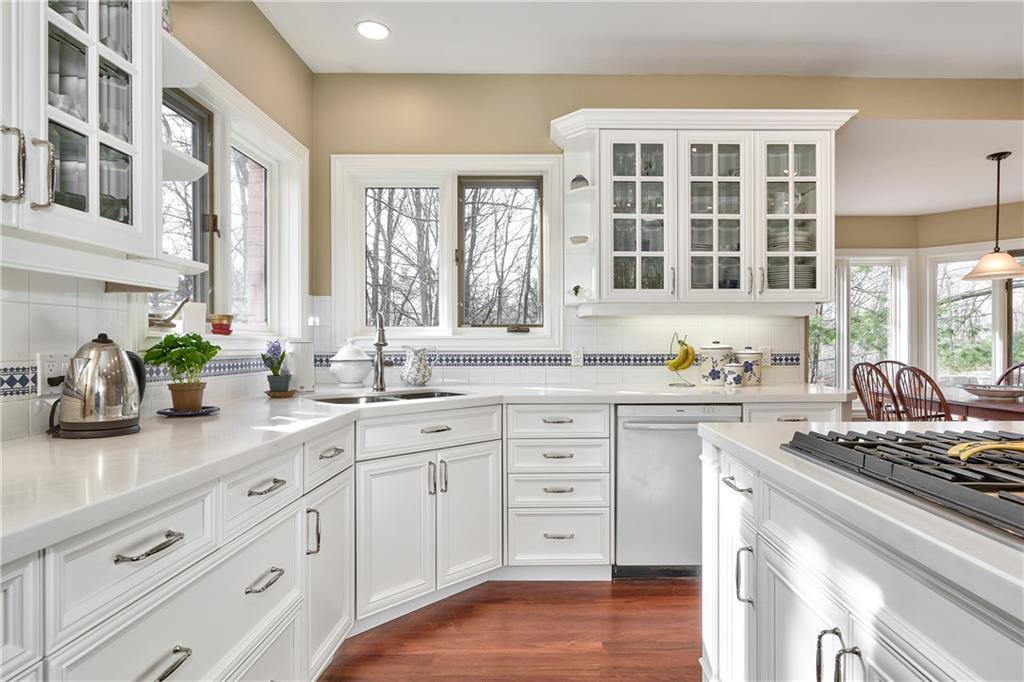 kitchen with white cabinets and countertops