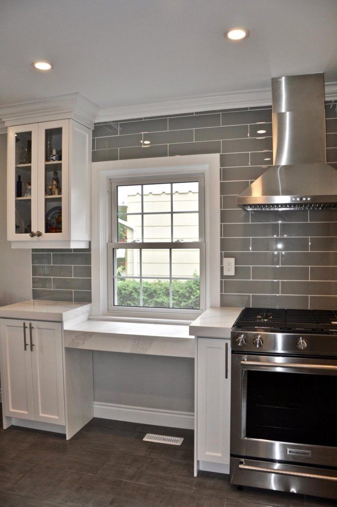 kitchen with white countertops and grey tiled floor