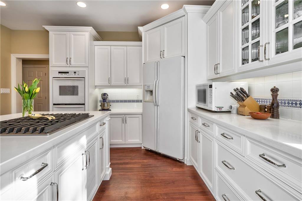 kitchen with white cabinets and countertops