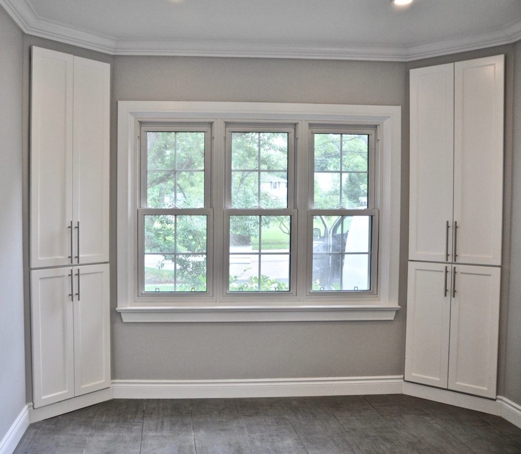 window centered between two cabinets