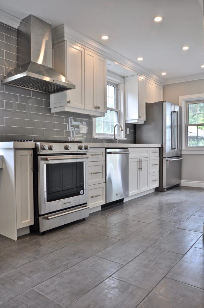 kitchen with white cabinets and grey tiled floor