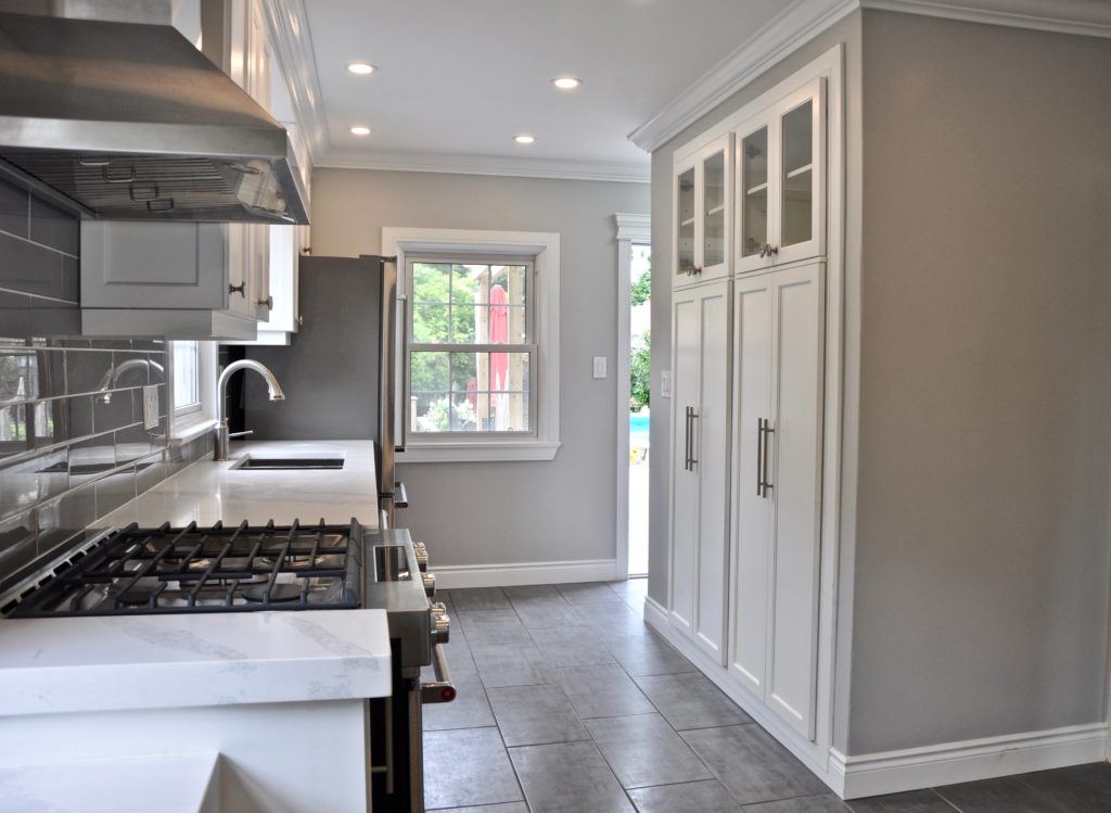 kitchen with white countertops and grey tiled floor